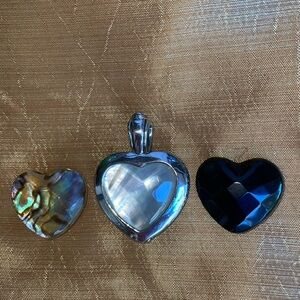 Reversible silver heart pendant with interchangeable semi precious stones.